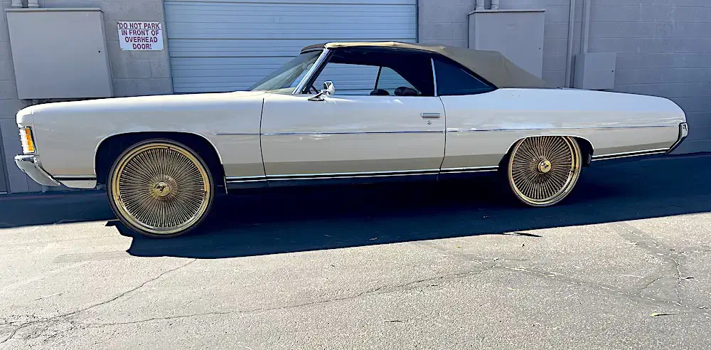 Devin Booker's old Cadillac on gold rims