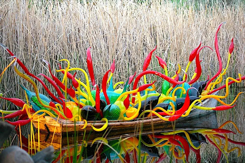 colorful glass sculptures in boat by Dale Chihuly