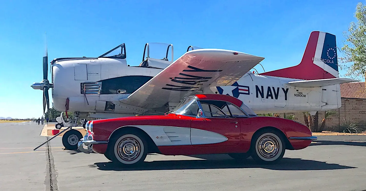 old U.S. Navy plane and red corvette